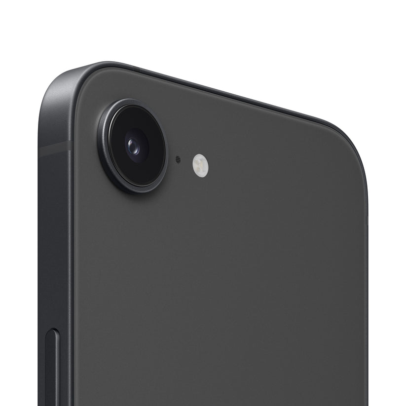 A close-up view of the dark-colored smartphone's rear camera module, highlighting the single protruding lens, a tiny microphone hole, and the adjacent circular flash ring.